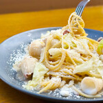 Spaghetti with squid, anchovies, cabbage and grana cheese