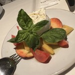 Raw burrata cheese caprese