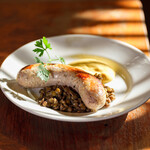 Homemade coarsely ground sausage served with stewed lentils