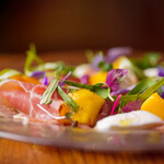 Buffalo mozzarella with seasonal fruits and Prosciutto