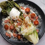 Grilled romaine lettuce Caesar salad, bacon, avocado, tomato, poached egg