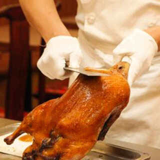 All-you-can-eat sweet-smelling traditional Peking duck grilled over fruit wood!