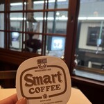 スマート珈琲店 - コースター。珈琲豆風なO。書体が可愛い。