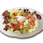 Caesar salad topped with warm egg