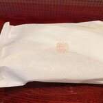 割烹 新多久 - 残ったごはんをパックに入れてもらいました