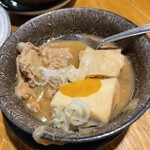 やきとん ひなた - 一口食べてしまったもつ煮込これも美味い！