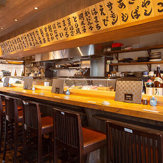 A cozy space with the warmth of wood, lined with signboards listing delicious menu items.