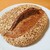 薪窯パン&カフェ リジュボア - 料理写真:オーツ麦とアーモンド(1100円)。ずっしり重いです…(⚠我が家では滅多に出番のない大きなお皿を使用しています)