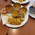 ニルワナム - 料理写真:とても美味しそうなカレーとビリヤニ♪なお、ビリヤニの左隣にある棒状のものは、根菜のお漬物のようなものでした。
