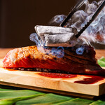 Luxury raw sea urchin topped with bluefin tuna and charcoal-grilled rare Steak Sushi ~ Mountain wasabi ~