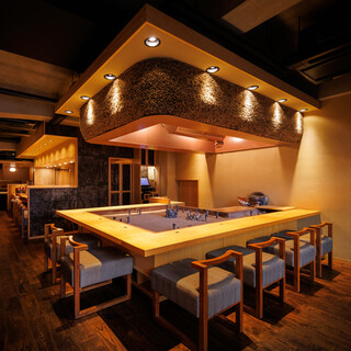 A modern counter surrounded by a hearth that evokes a sense of wabi-sabi.