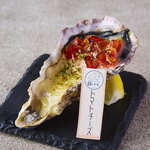 Grilled Oyster with fresh tomatoes and cheese