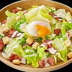 Caesar salad with soft-boiled eggs and grilled bacon