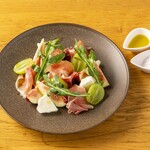 Salad with seasonal fruits, Prosciutto, and buffalo mozzarella cheese