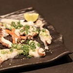 Carpaccio of raw octopus and salted sesame oil