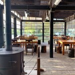 Okuizumo Budouen Niwa Cafe - The interior features a wood-burning stove, creating a cozy, greenhouse-like atmosphere.