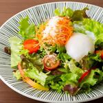 Caesar salad with hot spring eggs and bacon