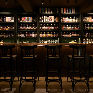 A relaxing space with attention to detail. Alcohol takes center stage in the darkness