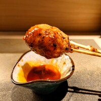 厳選焼鳥 一石三鳥 本店 - タレと卵黄をたっぷり絡めていただきます