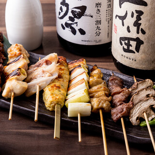 Exquisite Yakitori (grilled chicken skewers) carefully grilled over binchotan charcoal