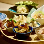 There are about 7 obanzai dishes prepared on the counter at any given time.