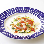 Scallop and vegetable marinated carpaccio with ripe tomato dressing
