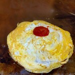 ぼてふく - 味付けしたお好み焼きを薄焼き玉子で覆います