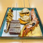 Assortment of 4 types of Seafood skewers