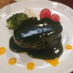 キッチン ブルー グローブ - 豚肩ロースポシェのアップ、目を見張るブリティッシュ・レイシング・グリーン色です