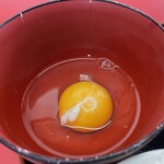 ラーメン もっけだの - 『朝食セット(ラーメンニンニク野菜マシマシ)』の生卵