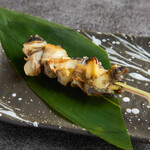 Grilled whelk skewers