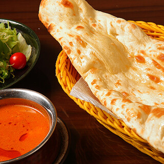 Enjoy our signature curry made with authentic spices with cheese naan