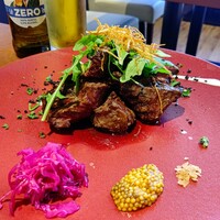 トラットリア イル レガーロ - アメリカ産アンガス牛ハラミのタリアータ オーガニックマスタード添え