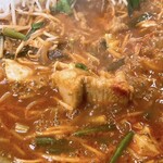 てっちゃん鍋 やすもり 尼崎本店 - てっちゃんに火が通ったら出来上がり