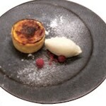 Basque cheesecake ~ Served with sweet and sour raspberries and rich rich vanilla ice cream ~