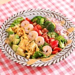 Cobb salad with fresh vegetables and plump shrimp, spicy lemon dressing with raw honey