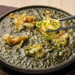 Grilled whelk with herb butter