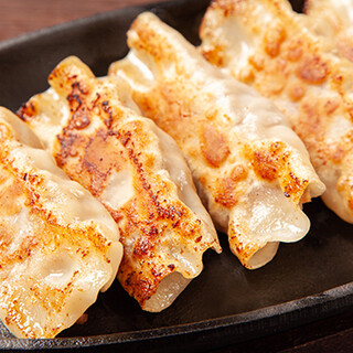 Enjoy ``Stick Gyoza / Dumpling'' and ``Boiled Gyoza / Dumpling'' with our unique blend of homemade chili oil.