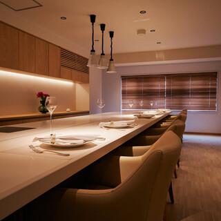 The elegant and comfortable interior offers private room seating and counter seating.
