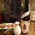 きんぼし - ドリンク写真:山廃本醸造・火入原酒『金鼓』の熱燗とあんぽ柿とクリームチーズの生ハム巻き