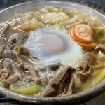 糸庄 - もつ煮込みうどん【たまご入り】　1100円（税込）