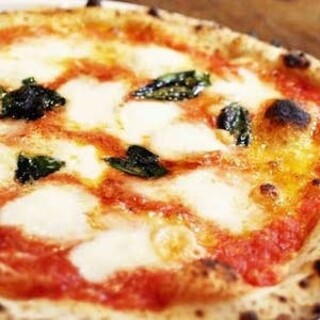 Fresh Neapolitan pizza baked in a pizza oven using domestic flour dough