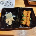 炭火牛串 狼煙 - 食べかけ　おつまみ2種