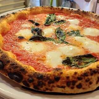 Authentic Neapolitan-style pizza baked in a wood-fired oven is exquisite!