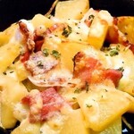 Grilled potatoes and bacon with cheese