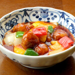 Traditional sweet and sour pork with pineapple or sweet and sour pork with root vegetables and matured black vinegar