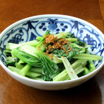 Seasonal green vegetables fried with garlic
