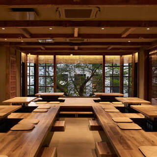 The interior of the restaurant has a traditional Japanese feel, with large windows stretching out on one side and creating an open feeling.