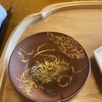 喜想菴 - 今年の干支の龍が描かれた器で、食前酒は金柑酒。