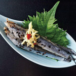 Sardines pickled in sesame seeds